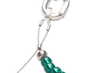 Step 2: Wire with a wire protector on a loop on the bottom, top shows an oval clasp at the ended of a beaded strand